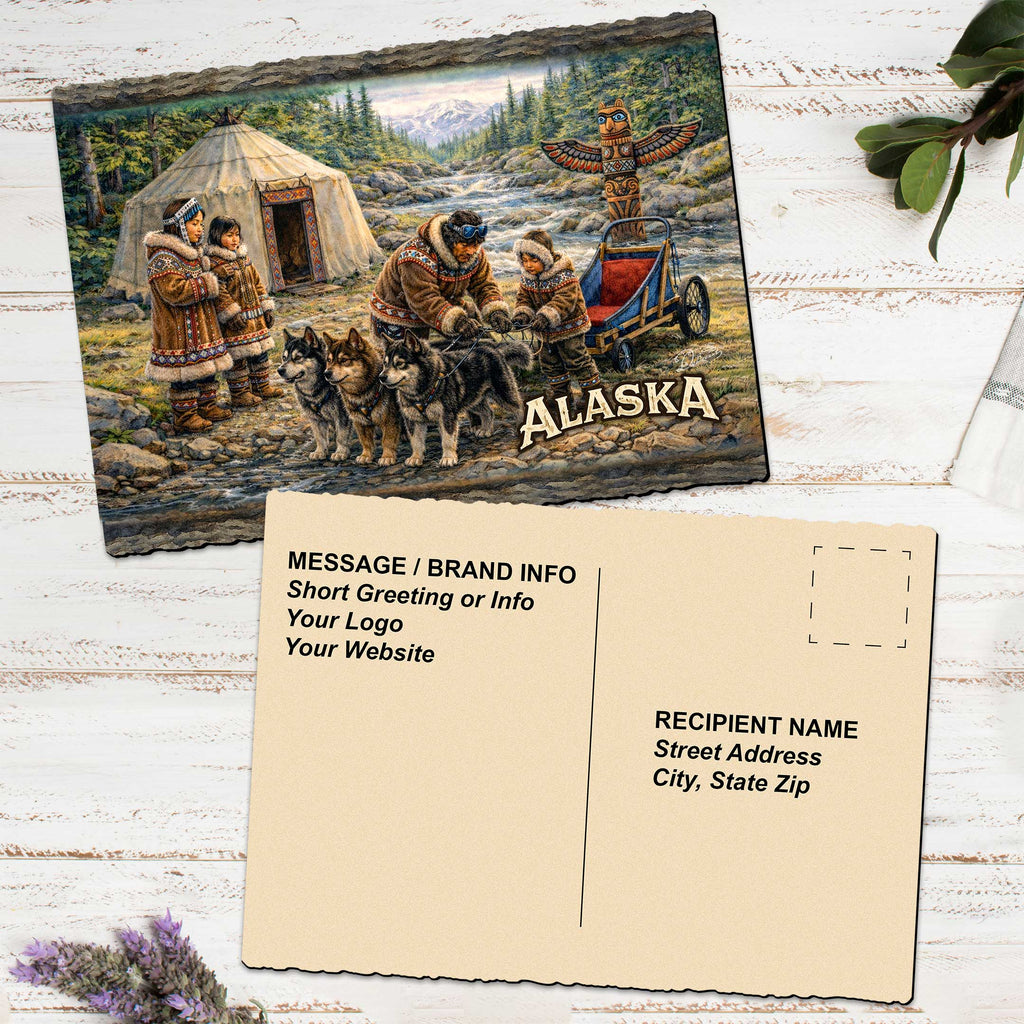 The image is a postcard featuring a painting of a Native American scene with a tent, people, and dogs, along with the word 